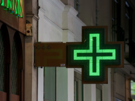 Street view of pharmacy sign in Paris.
